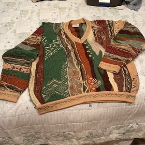 Men’s L COOGI sweater. Looks great on women too. Multi colors. Great condition!